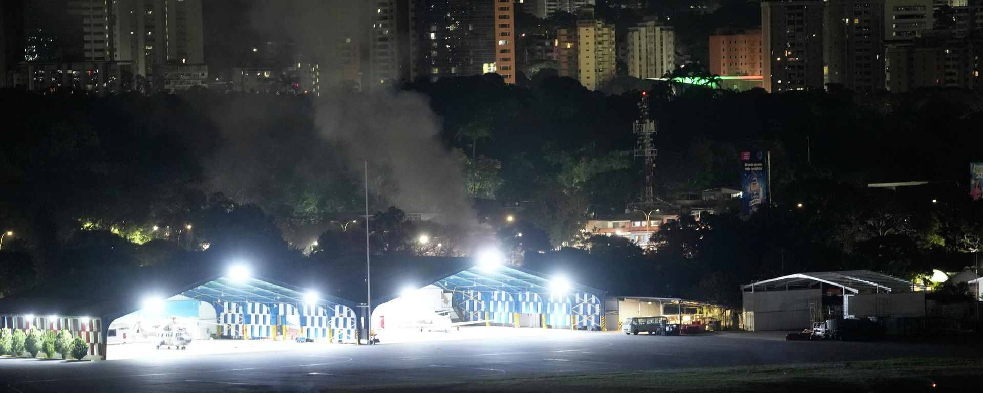 Smoke raises at La Carlota airport after explosions and low-flying aircraft were heard in Caracas, Venezuela, Saturday, Jan. 3, 2026. - Sputnik International, 1920, 28.01.2026