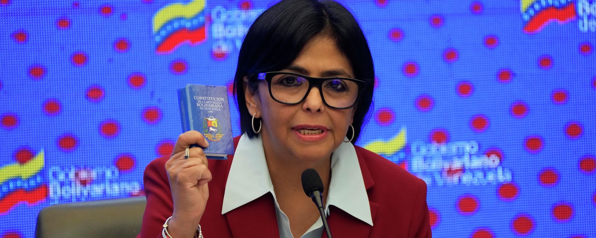 Acting President Delcy Rodriguez holds up a copy of the Venezuela National Constitution - Sputnik International, 1920, 16.01.2026