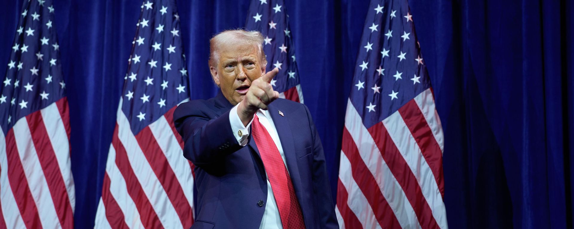 President Donald Trump points to the crowd as he walks off stage after speaking to House Republican lawmakers during their annual policy retreat, Tuesday, Jan. 6, 2026, in Washington - Sputnik International, 1920, 07.01.2026