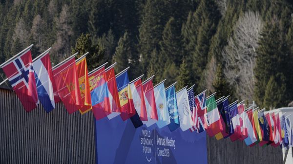 Flags decorate the Congress Center where the Annual Meeting of the World Economy Forum take place in Davos, Switzerland, Monday, Jan. 19, 2026.  - Sputnik International