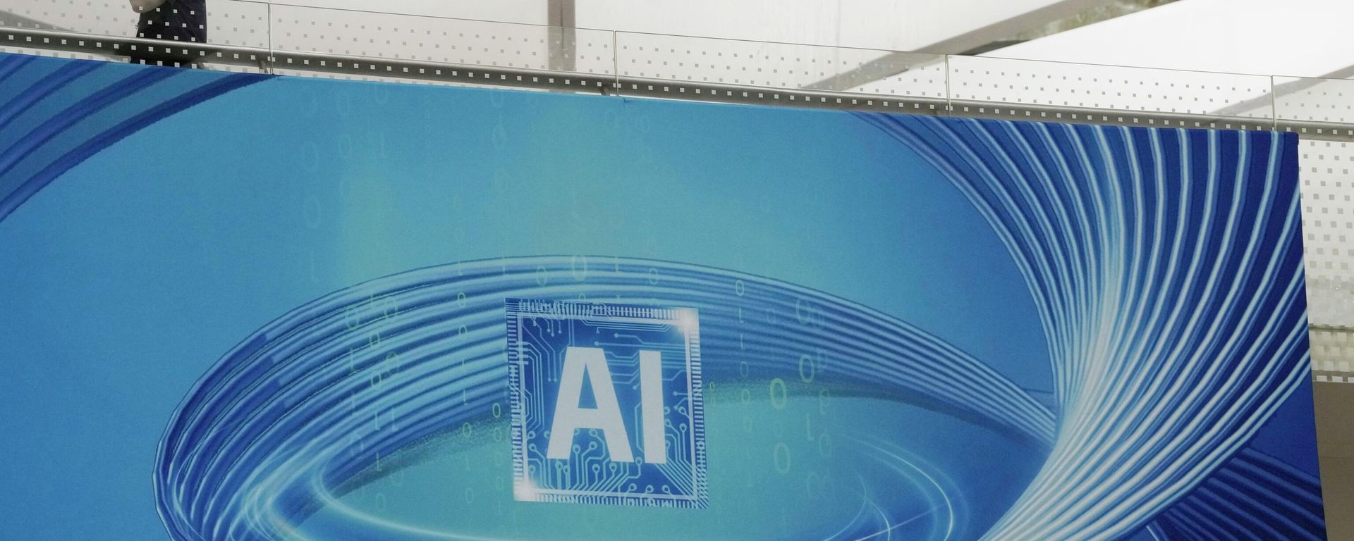 A visitor past by an ad promoting Artificial Intelligence for the upcoming World Artificial Intelligence Conference held in Shanghai, Wednesday, July 5, 2023. (AP Photo/Ng Han Guan) - Sputnik International, 1920, 23.04.2026