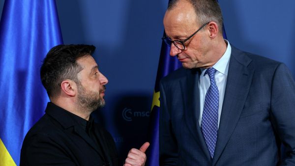 German Chancellor Friedrich Merz, right, meets Ukrainian President Volodymyr Zelensky during the Munich Security Conference in Munich, Germany, Friday, Feb. 13, 2026. (Michaela Stache/Pool Photo via AP) - Sputnik International