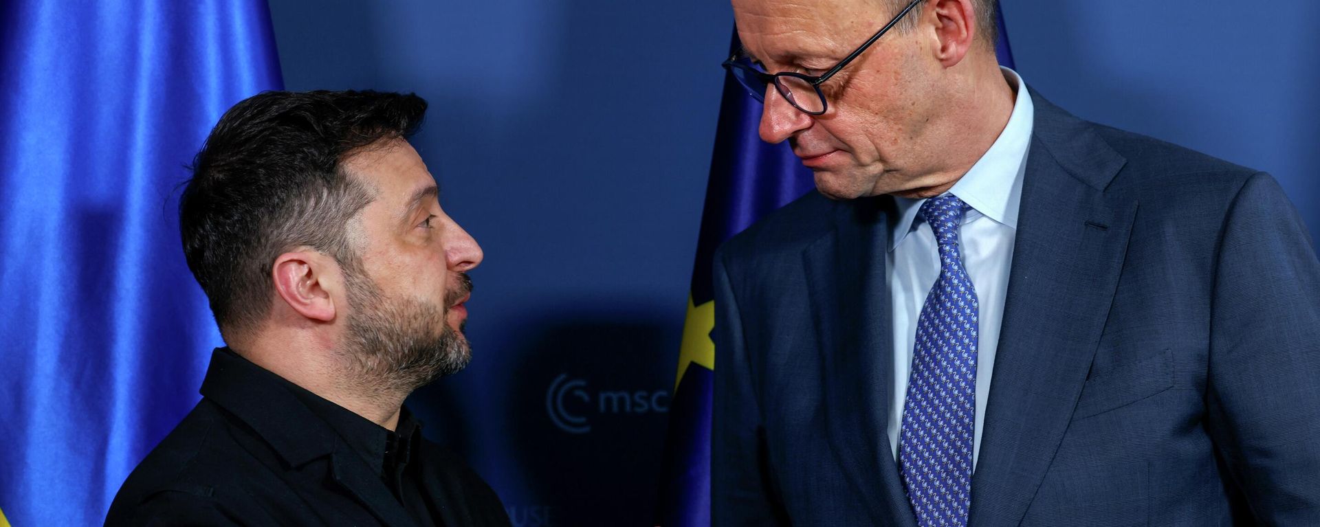 German Chancellor Friedrich Merz, right, meets Ukrainian President Volodymyr Zelensky during the Munich Security Conference in Munich, Germany, Friday, Feb. 13, 2026. (Michaela Stache/Pool Photo via AP) - Sputnik International, 1920, 26.02.2026