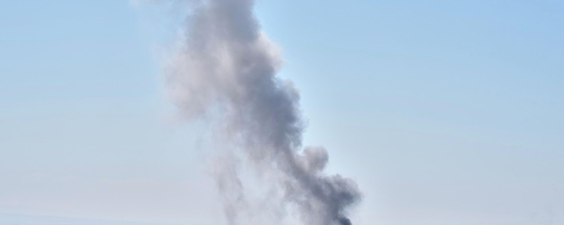 A plume of smoke rises after a strike in Tehran, Iran, Sunday, March 1, 2026. - Sputnik International, 1920, 01.03.2026