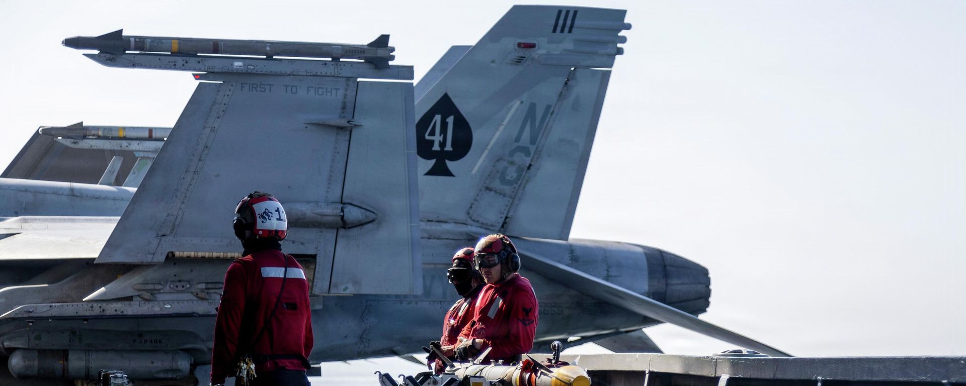 This image provided by US Central Command shows Navy sailors looking over ordnance on the flight deck of the USS Abraham Lincoln (CVN 72) in support of Operation Epic Fury on March 2, 2026.. - Sputnik International, 1920, 12.03.2026
