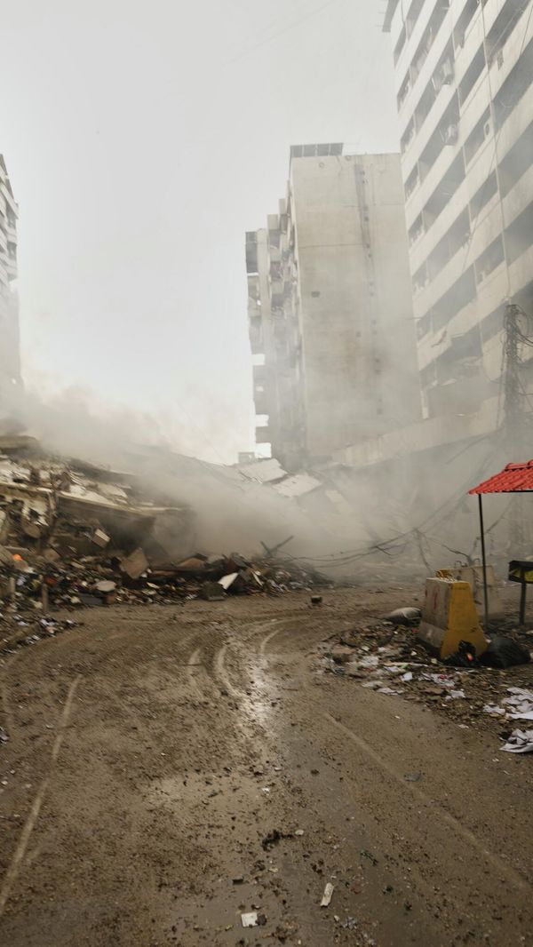 A man photographs the rubble of buildings destroyed in an Israeli airstrike in Dahiyeh, Beirut's southern suburbs, Lebanon, Sunday, March 15, 2026. (AP Photo/Hassan Ammar) A man photographs the rubble of buildings destroyed in an Israeli airstrike in Dahiyeh, Beirut's southern suburbs, Lebanon, Sunday, March 15, 2026. (AP Photo/Hassan Ammar) - Sputnik International