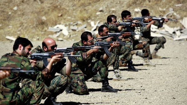 In this Thursday, Sept. 19, 2013 photo, members of the Basij paramilitary militia fire their weapons during a training session, in Tehran, Iran - Sputnik International