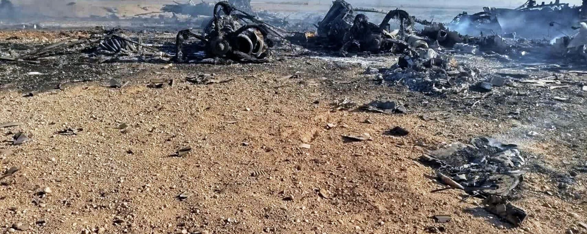 In this image provided by Sepahnews, the Iranian Revolutionary Guard's official website, wreckage is shown at what Iran's state TV said was the site of a downed American transport plane and two helicopters involved in a rescue operation, in Isfahan province, Iran, April, 2026.  - Sputnik International, 1920, 07.04.2026