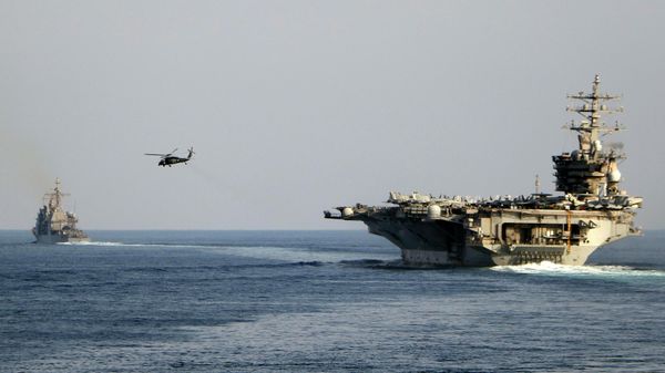 The aircraft carrier USS Dwight D. Eisenhower and other warships crosses the Strait of Hormuz into the Persian Gulf on Sunday. File photo. - Sputnik International