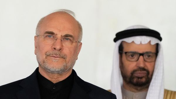 Iran's Parliament Speaker Mohammad Bagher Ghalibaf, left, and Ali AlNuaimi of the United Arab Emirates pose during a group photo at the 11th BRICS Parliamentary Forum held at the Federal Senate in Brasilia, Brazil, Wednesday, June 4, 2025 - Sputnik International