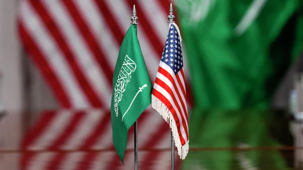 American and Saudi Arabia flags are seen during a meeting of Secretary of Defense Pete Hegseth and Saudi Defense Minister Prince Khalid bin Salman, Monday, Feb. 24, 2025, at the Pentagon in Washington. (AP Photo/Jacquelyn Martin) - Sputnik International