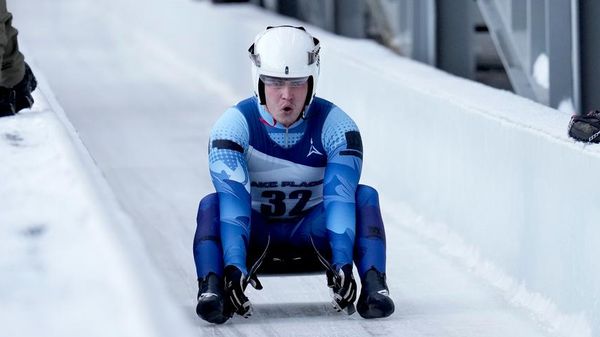 Matvei Perestoronin, a Russian luge athlete, finishes a qualifying race to compete in a Luge World Cup event in Lake Placid, New York, on December 18, 2025. - Sputnik International