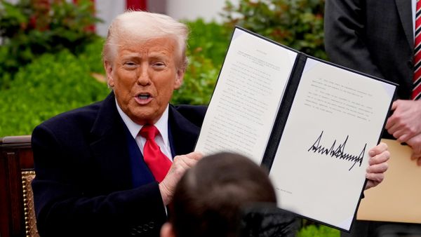 President Donald Trump holds a signed executive order during an event to announce new tariffs in the Rose Garden of the White House, Wednesday, April 2, 2025, in Washington - Sputnik International