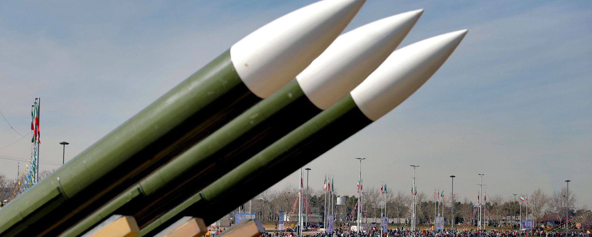Iranians drive past missiles by their motorcycles during a rally marking the 42nd anniversary of the Islamic Revolution, at Azadi (Freedom) Square in Tehran, Iran, Wednesday, Feb. 10, 2021 - Sputnik International, 1920, 22.08.2026