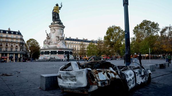 A destroyed car near the Marianne statue at the Place de la Republique, with a yellow vest put on it, the day after clashes during a national day of demonstrations against the cost of living and rising fuel prices, in Paris, France, October 18, 2026 - Sputnik International