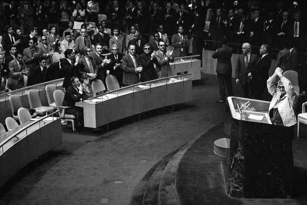 Yasser Arafat addresses the United Nations General Assembly in New York, Nov. 14, 1974. The empty seats in foreground, left, were left unoccupied by the Israeli delegation. Yasser Arafat addresses the United Nations General Assembly in New York, Nov. 14, 1974. The empty seats in foreground, left, were left unoccupied by the Israeli delegation. - Sputnik International