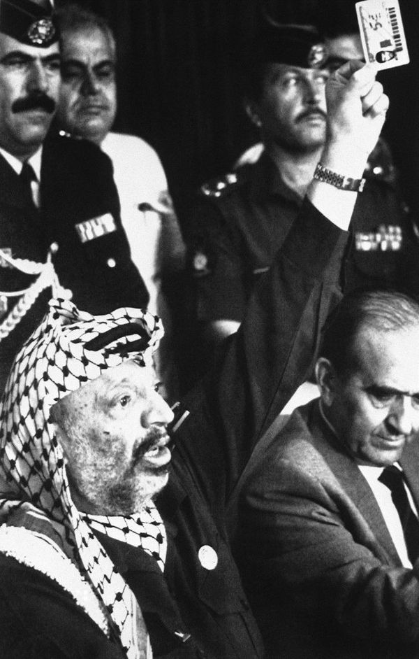 PLO Chairman Yasser Arafat waves one of the plastic identity cards Israel has imposed on Gaza Strip Palestinians working in Israel, in Amman, Jordan on August 22, 1989. He asked the US to condemn the card as a form of discrimination PLO Chairman Yasser Arafat waves one of the plastic identity cards Israel has imposed on Gaza Strip Palestinians working in Israel, in Amman, Jordan on August 22, 1989. He asked the US to condemn the card as a form of discrimination - Sputnik International