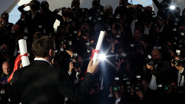 Director Andrey Zvyagintsev poses after winning the Best Screenplay award for the film Leviathan during a photo call following the awards ceremony at the 67th international film festival, Cannes - Sputnik International