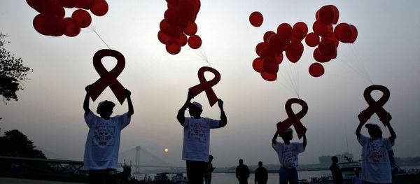 Children display ribbon cut-outs tied to balloons during an HIV/AIDS awareness campaign to mark World AIDS Day in Kolkata December 1, 2014. The world has finally reached the beginning of the end of the AIDS pandemic that has infected and killed millions in the past 30 years, according to a leading campaign group fighting HIV. United Nations data show that in 2013, 35 million people were living with HIV, 2.1 million people were newly infected with the virus and some 1.5 million people died of AIDS. By far the greatest part of the HIV/AIDS burden is in sub-Saharan Africa. Children display ribbon cut-outs tied to balloons during an HIV/AIDS awareness campaign to mark World AIDS Day in Kolkata December 1, 2014. The world has finally reached the beginning of the end of the AIDS pandemic that has infected and killed millions in the past 30 years, according to a leading campaign group fighting HIV. United Nations data show that in 2013, 35 million people were living with HIV, 2.1 million people were newly infected with the virus and some 1.5 million people died of AIDS. By far the greatest part of the HIV/AIDS burden is in sub-Saharan Africa. - Sputnik International