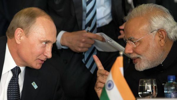 Russia's President Vladimir Putin, left, and India's Prime Minister Narendra Modi chat during the BRICS Summit at the Itamaraty Palace, in Brasilia, Brazil, Wednesday, July 16, 2014 Russia's President Vladimir Putin, left, and India's Prime Minister Narendra Modi chat during the BRICS Summit at the Itamaraty Palace, in Brasilia, Brazil, Wednesday, July 16, 2014 - Sputnik International