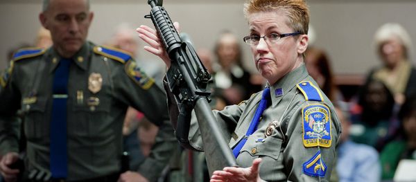 In this Jan. 28, 2013, file photo, firearms training unit Detective Barbara J. Mattson, of the Connecticut State Police, holds up a Bushmaster AR-15 rifle, the same make and model of gun used by Adam Lanza in the Sandy Hook School shooting, for a demonstration during a hearing of a legislative subcommittee reviewing gun laws, at the Legislative Office Building in Hartford, Connecticut. - Sputnik International