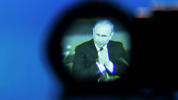 Russian President Vladimir Putin seen gesturing in a camera viewfinder during his annual news conference in Moscow, Russia, Thursday, Dec. 18, 2014. The Russian economy will rebound and the ruble will stabilize, Russian President Vladimir Putin said Thursday at his annual press conference, he also said Ukraine must remain one political entity, voicing hope that the crisis could be solved through peace talks. Russian President Vladimir Putin seen gesturing in a camera viewfinder during his annual news conference in Moscow, Russia, Thursday, Dec. 18, 2014. The Russian economy will rebound and the ruble will stabilize, Russian President Vladimir Putin said Thursday at his annual press conference, he also said Ukraine must remain one political entity, voicing hope that the crisis could be solved through peace talks. - Sputnik International