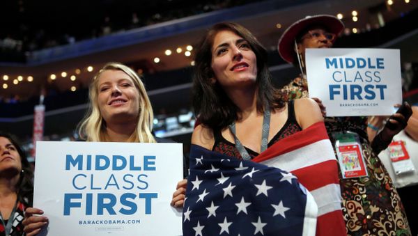 In this Sept. 5, 2012, file photo, delegates watch as former President Bill Clinton addresses the Democratic National Convention in Charlotte, N.C. Since 2008, the number of people who call themselves middle class has fallen by a fifth, according to a survey in January 2014 by the Pew Research Center, from 53 percent to 44 percent. In this Sept. 5, 2012, file photo, delegates watch as former President Bill Clinton addresses the Democratic National Convention in Charlotte, N.C. Since 2008, the number of people who call themselves middle class has fallen by a fifth, according to a survey in January 2014 by the Pew Research Center, from 53 percent to 44 percent. - Sputnik International