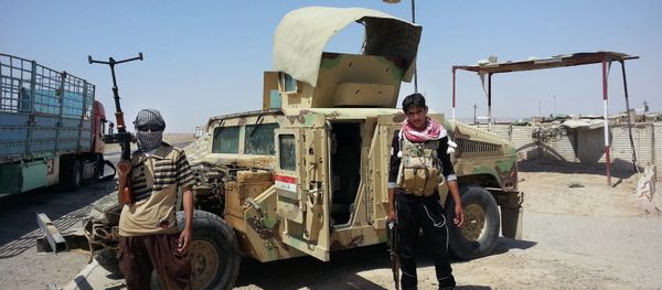 In this file photo, Islamic State group militants stand with a captured Iraqi army Humvee at a checkpoint outside Beiji refinery, around 155 miles north of Baghdad, Iraq. In this file photo, Islamic State group militants stand with a captured Iraqi army Humvee at a checkpoint outside Beiji refinery, around 155 miles north of Baghdad, Iraq. - Sputnik International