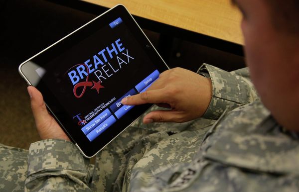 Sgt. Mark Miranda, a public affairs specialist stationed at Joint Base Lewis-McChord in Washington state, demonstrates the use of a program for tablet computers and smart phones that is designed to help calm symptoms of post-traumatic stress and traumatic brain injury, Friday, July 22, 2011. Miranda said he does not suffer from PTSD, but after trying the app, he said he may suggest its use to other soldiers who he has deployed with. - Sputnik International