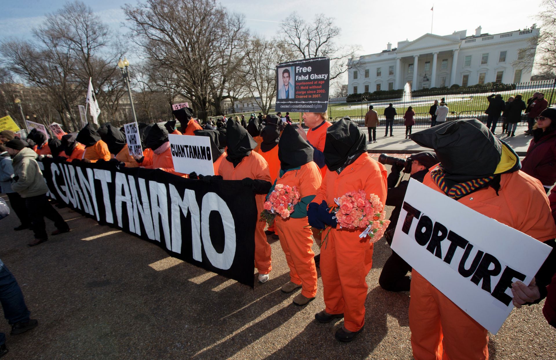 Protesters dressed as detainees gather in front of the White House on Sunday, during a rally to mark the 13th anniversary of the first detainees in the U.S.'s war on terror being brought to the detention center at Guantanamo Bay Naval Base in Cuba. Protesters dressed as detainees gather in front of the White House on Sunday, during a rally to mark the 13th anniversary of the first detainees in the U.S.'s war on terror being brought to the detention center at Guantanamo Bay Naval Base in Cuba. - Sputnik International, 1920, 04.11.2021
