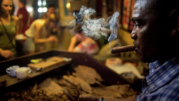 A worker rolls cigars during a demonstration for tourists at a cigar club shop in Havana, Cuba, Friday, Dec. 19, 2014. Cigars brought back to the U.S. must be for personal use, not resale - same as the rules that existed for travelers before August 2004, when the Bush administration imposed strict restrictions those traveling to the island. A worker rolls cigars during a demonstration for tourists at a cigar club shop in Havana, Cuba, Friday, Dec. 19, 2014. Cigars brought back to the U.S. must be for personal use, not resale - same as the rules that existed for travelers before August 2004, when the Bush administration imposed strict restrictions those traveling to the island. - Sputnik International