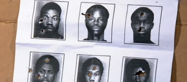 South Florida police officers are using mugshots of African-American men for target practice. South Florida police officers are using mugshots of African-American men for target practice. - Sputnik International