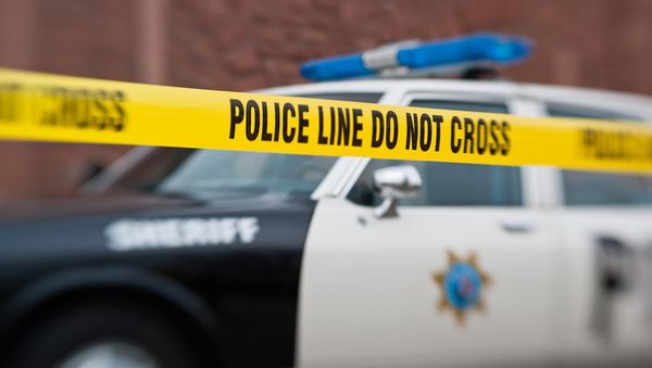A police car behind a police do not cross line. - Sputnik International