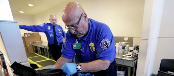 A TSA agent checks a bag at a security checkpoint area at Midway International Airport, Friday, Nov. 21, 2014, in Chicago. A TSA agent checks a bag at a security checkpoint area at Midway International Airport, Friday, Nov. 21, 2014, in Chicago. - Sputnik International