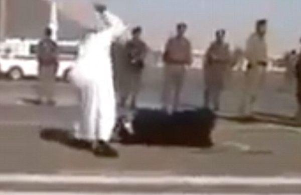 Screenshot of video leaked from Saudi Arabia showing the beheading of a woman accused of beating her daughter to death. - Sputnik International