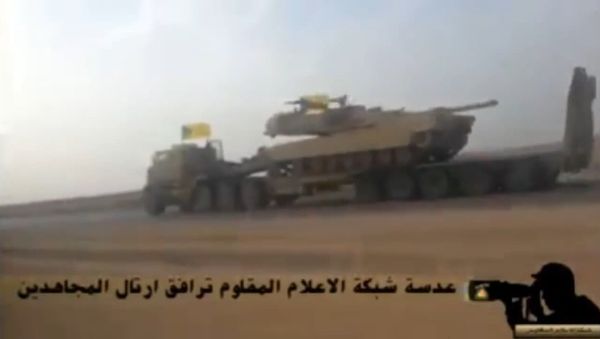 In this screenshot from a video uploaded to YouTube, a Hezbollah Brigades convoy transports an American-made M1 Abrams tank to the front lines of the battle with ISIL. In this screenshot from a video uploaded to YouTube, a Hezbollah Brigades convoy transports an American-made M1 Abrams tank to the front lines of the battle with ISIL. - Sputnik International