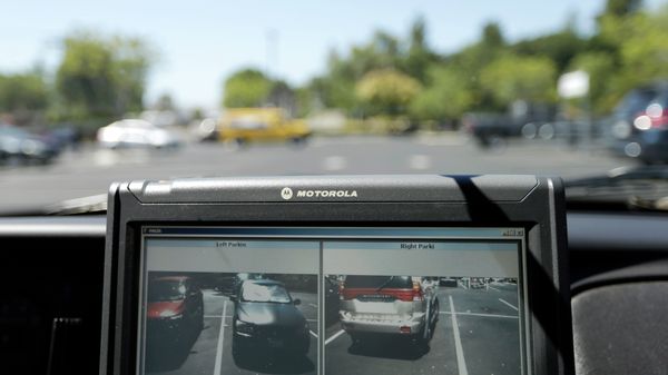 A Drug Enforcement Administration agent proposed using license-plate readers, such as this one, to track vehicles at gun shows. - Sputnik International