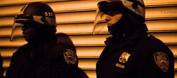 NYPD crowd control officers keep watch on a march of demonstrators as they protest against the shooting of Kimani Kiki Gray on Thursday, March 14, 2013 in the East Flatbush neighborhood of Brooklyn, N.Y. The 16-year-old was shot to death on a Brooklyn street last Saturday night by plainclothes police officers who claim the youth pointed a .38-caliber revolver at them, while the family says Gray was unarmed. NYPD crowd control officers keep watch on a march of demonstrators as they protest against the shooting of Kimani Kiki Gray on Thursday, March 14, 2013 in the East Flatbush neighborhood of Brooklyn, N.Y. The 16-year-old was shot to death on a Brooklyn street last Saturday night by plainclothes police officers who claim the youth pointed a .38-caliber revolver at them, while the family says Gray was unarmed. - Sputnik International