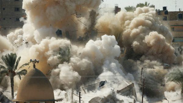 Smoke rises after a house is blown up during a military operation by Egyptian security forces in the Egyptian city of Rafah, near the border with southern Gaza Strip October 29, 2014. At least 33 Egyptian security personnel were killed on Friday in the Sinai Peninsula bordering Israel and Gaza, in an attack on a checkpoint that bore the marks of assaults claimed by Egypt's most active militant group Ansar Bayt al-Maqdis - Sputnik International