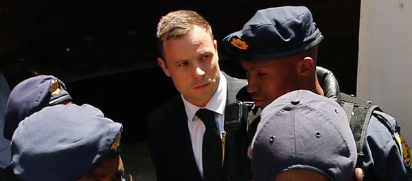 South African Olympic and Paralympic sprinter Oscar Pistorius (C) is escorted to a police van after his sentencing at the North Gauteng High Court in Pretoria October 21, 2014 South African Olympic and Paralympic sprinter Oscar Pistorius (C) is escorted to a police van after his sentencing at the North Gauteng High Court in Pretoria October 21, 2014 - Sputnik International