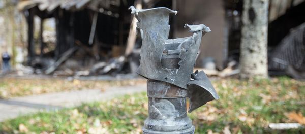 The remains of a projectile is seen in front of shops damaged by recent shellings in Donetsk, eastern Ukraine, October 21, 2014 The remains of a projectile is seen in front of shops damaged by recent shellings in Donetsk, eastern Ukraine, October 21, 2014 - Sputnik International