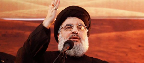Lebanon's Hezbollah leader Sayyed Hassan Nasrallah addresses his supporters during a rare public appearance at an Ashoura ceremony in Beirut's southern suburbs November 3, 2014 - Sputnik International