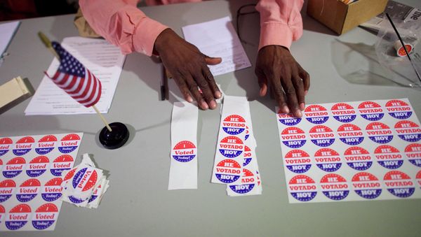 A majority inspector arranges 'I Voted Today!' stickers at registration on U.S. midterm election day morning at Holmes School Senior Center in Philadelphia, Pennsylvania, November 4, 2014 A majority inspector arranges 'I Voted Today!' stickers at registration on U.S. midterm election day morning at Holmes School Senior Center in Philadelphia, Pennsylvania, November 4, 2014 - Sputnik International