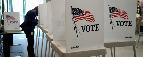 A voter fills in her ballot as she votes in the U.S. midterm elections at a polling place in Westminster, Colorado November 4, 2014 A voter fills in her ballot as she votes in the U.S. midterm elections at a polling place in Westminster, Colorado November 4, 2014 - Sputnik International