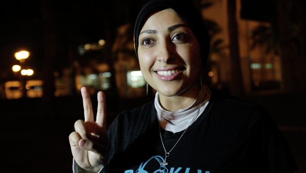 Human rights activist Maryam al-Khawaja flashes the victory sign outside a police station in Muharraq, Bahrain, Thursday, Sept. 18, 2014 Human rights activist Maryam al-Khawaja flashes the victory sign outside a police station in Muharraq, Bahrain, Thursday, Sept. 18, 2014 - Sputnik International