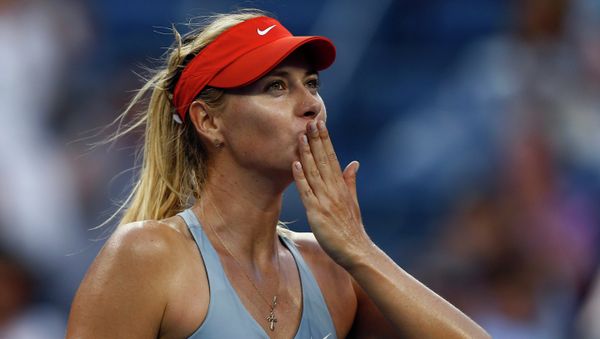 Maria Sharapova, of Russia, blows kisses to the crowd after defeating Alexandra Dulgheru, of Romania, during the second round of the 2014 U.S. Open tennis tournament, Wednesday, Aug. 27, 2014, in New York Maria Sharapova, of Russia, blows kisses to the crowd after defeating Alexandra Dulgheru, of Romania, during the second round of the 2014 U.S. Open tennis tournament, Wednesday, Aug. 27, 2014, in New York - Sputnik International