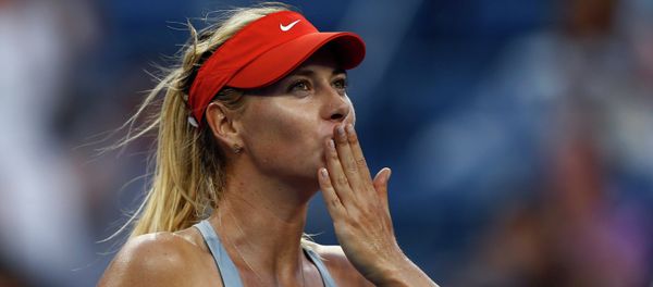 Maria Sharapova, of Russia, blows kisses to the crowd after defeating Alexandra Dulgheru, of Romania, during the second round of the 2014 U.S. Open tennis tournament, Wednesday, Aug. 27, 2014, in New York - Sputnik International
