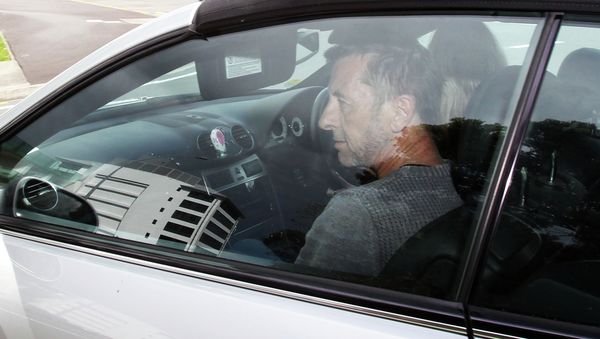 AC/DC drummer Phil Rudd leaves Tauranga District Court after being charged with attempting to procure murder at Tauranga District Court on November 6, 2014 in Tauranga, New Zealand - Sputnik International
