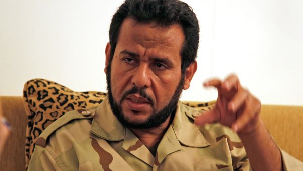 Abdel Hakim Belhaj and Sami al-Saadi, two Libyan exiles who were abducted in Southeast Asia in 2004 and sent by British and US Intelligence agencies to Libya to face punishment and torture, filed the suit in mid-October - Sputnik International