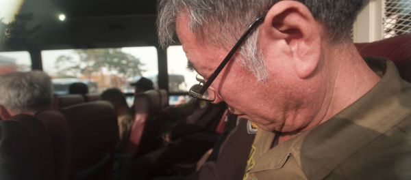Lee Joon-seok, the captain of the sunken South Korean ferry Sewol, on the bus, arrives for verdict and sentence session at Gwangju District Court in Gwangju, South Korea, Tuesday, Nov. 11, 2014 Lee Joon-seok, the captain of the sunken South Korean ferry Sewol, on the bus, arrives for verdict and sentence session at Gwangju District Court in Gwangju, South Korea, Tuesday, Nov. 11, 2014 - Sputnik International
